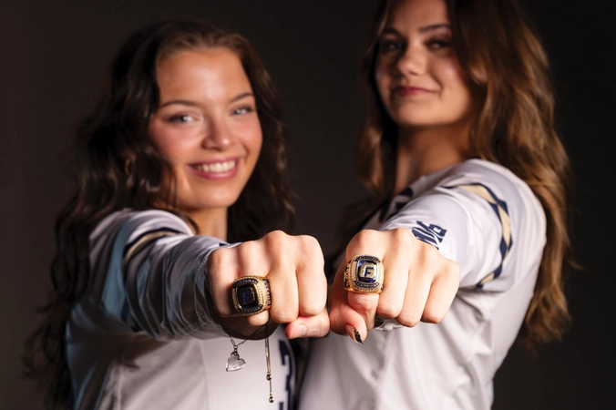 2 STUNT athletes show their 2025 national championship rings to the camera