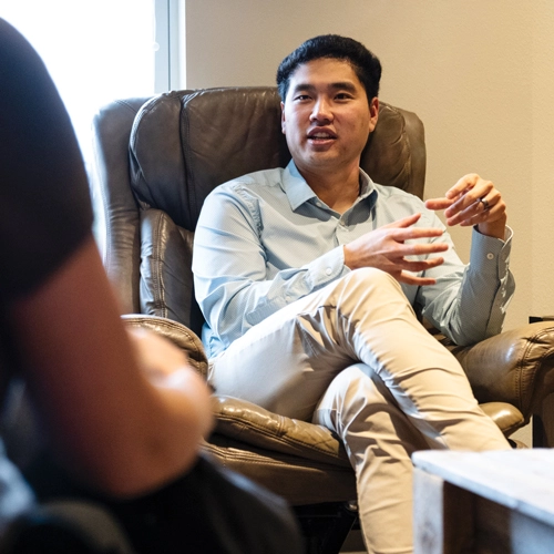 Nathan Higa meeting with a client
