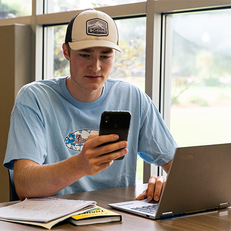 A student using her laptop