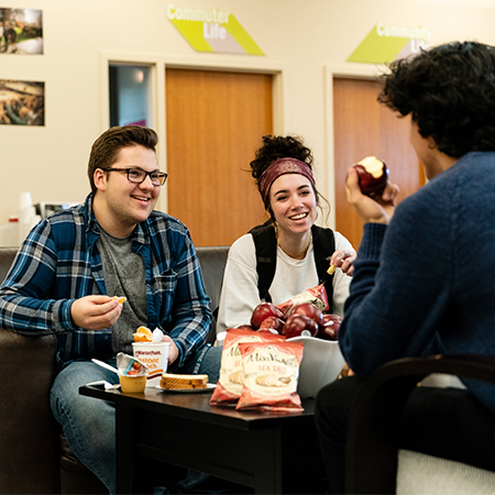 Three friends enjoying time together over some snacks