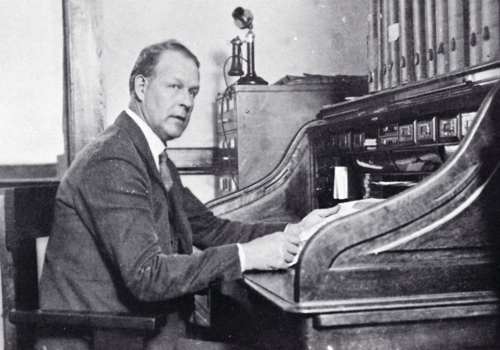 Levi Pennington sits at a desk