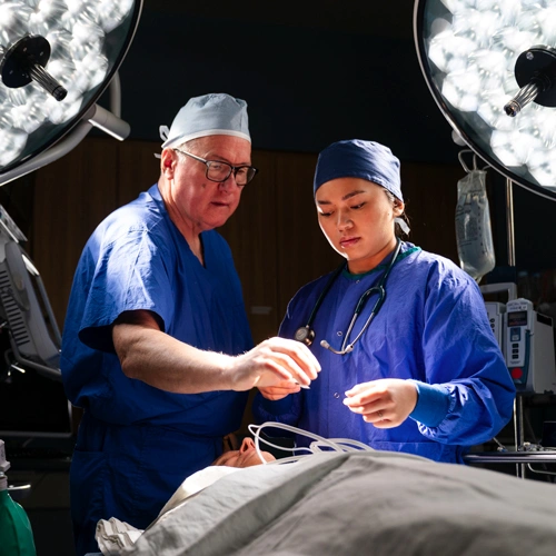 Dr. Bill Prosser and a student work with a patient