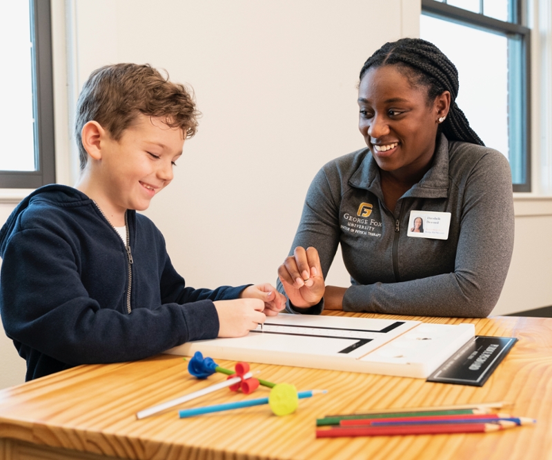 Student working with child