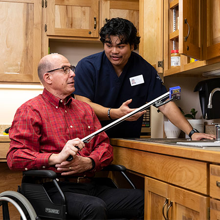 Occupational Therapist working with an elderly person