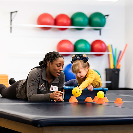 Occupational Therapist working with a young child