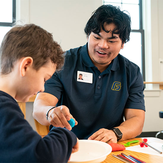 Occupational Therapy student working with a child