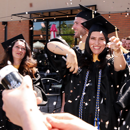 Graduates celebrating after the commencement