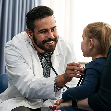 Doctor examining a pediatric patient