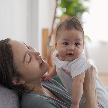 A mom holding a baby