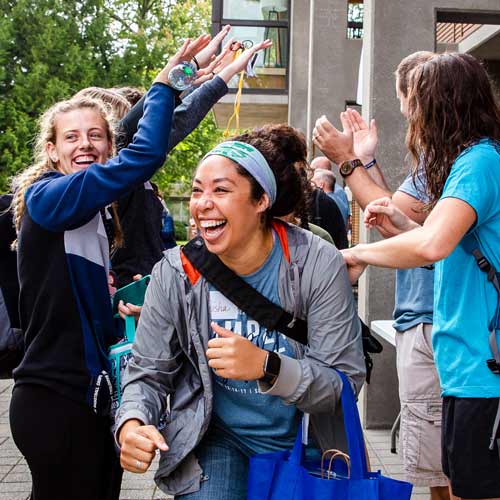 Employee runs through crowd of students