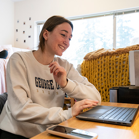 A student working on her laptop