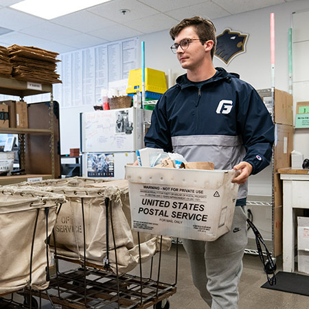 A student working at the mailroom