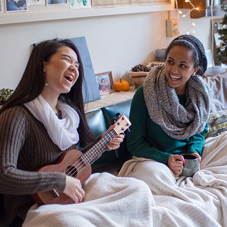 Two happy roommates in their dorm