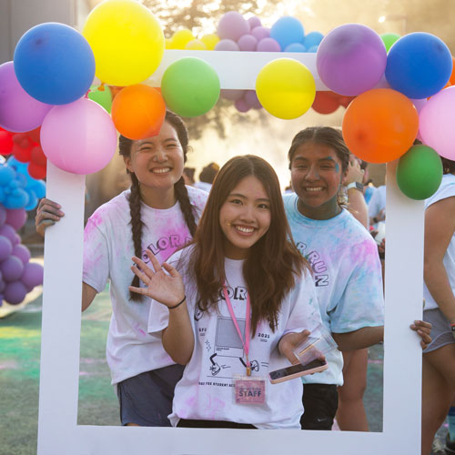 students celebrate on the football field