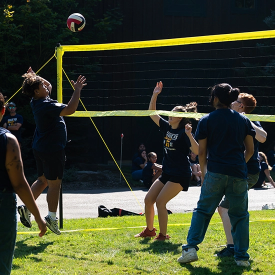 students playing volleyball