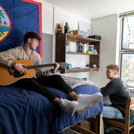 two roommates laugh together