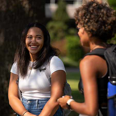 Two friends laughing together