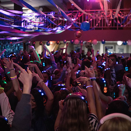 Students dance with headphones on