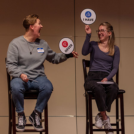 Two students on the stage for the Dating Game