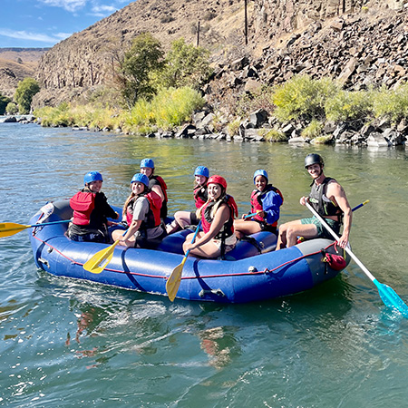 A group of students on a rafting trip