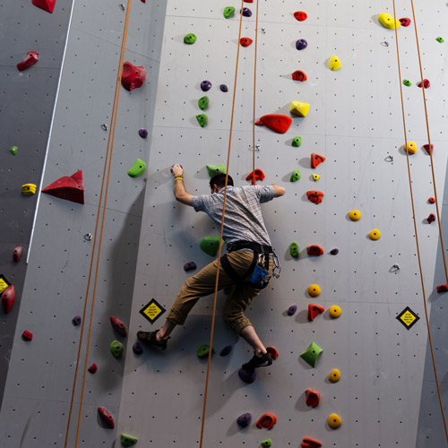 roped student climbs