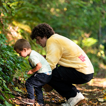 students looking at leaves