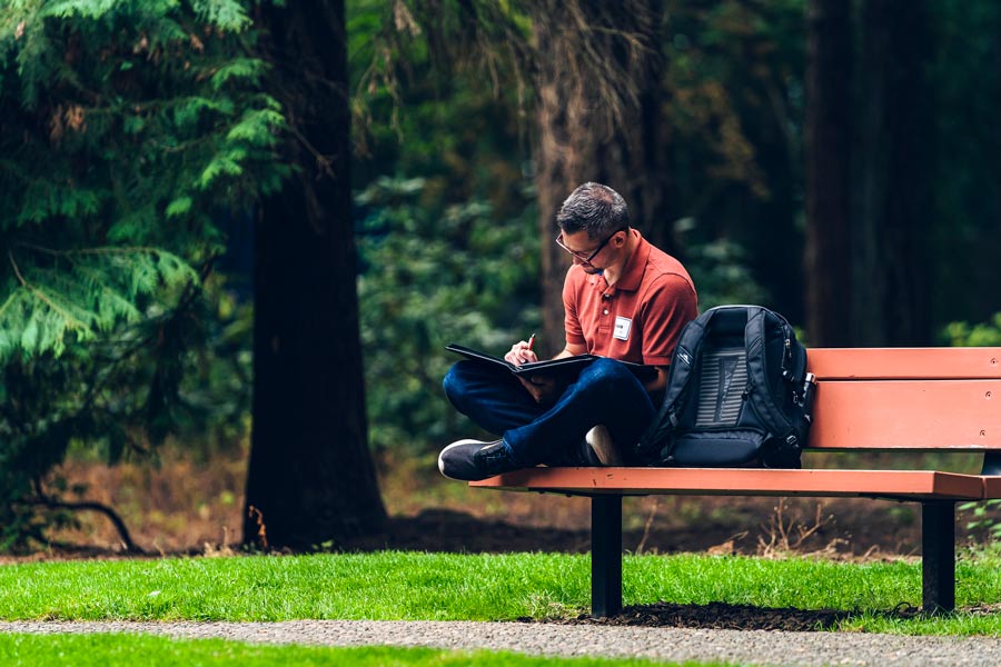 Someone reads on a bench