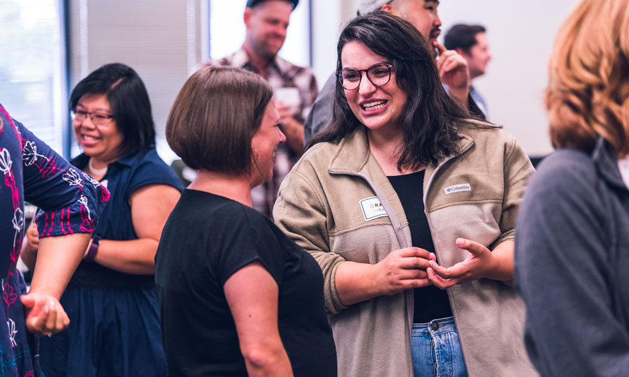 Two women talking at an event