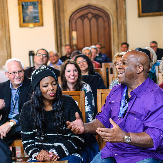 Seminary students talk in lecture