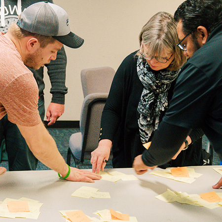 Portland Seminary faculty mentor talking with students