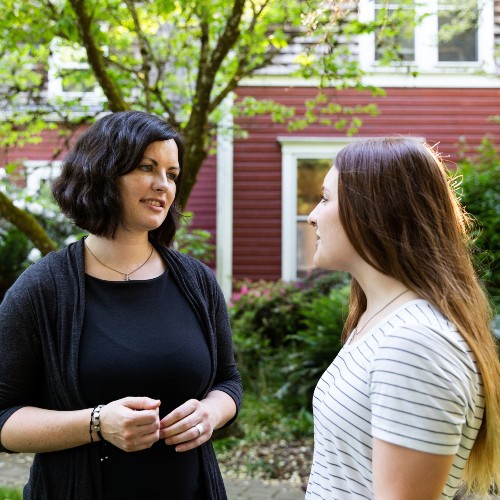 faculty talking with a student