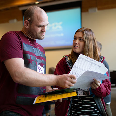 A student intern discussing with a mentor