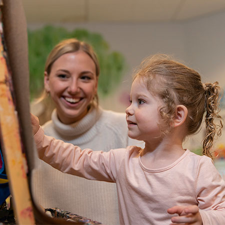 A social worker working with a child