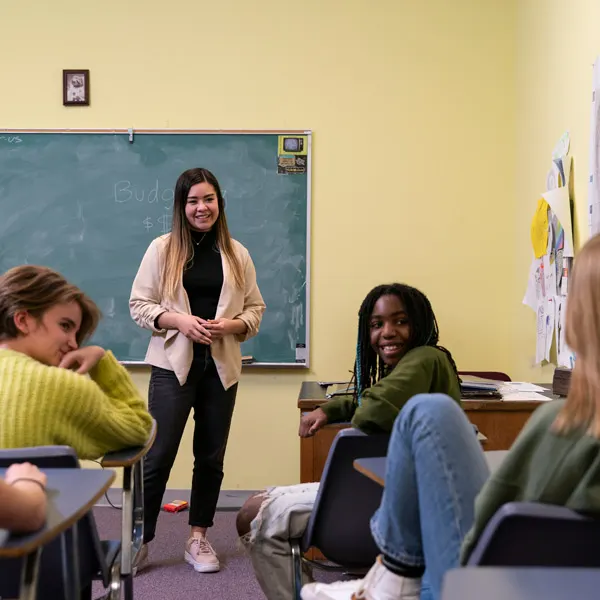 School social worker teaches class with student